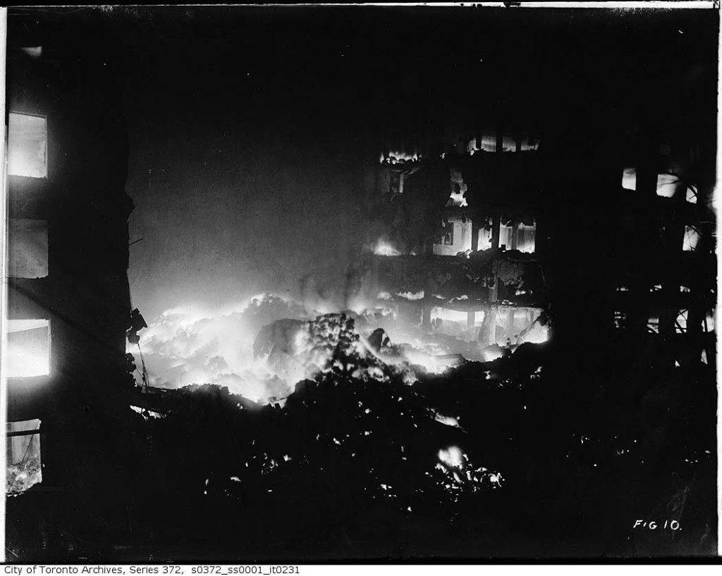 Burning rubble at night. | DustSafetyScience.com